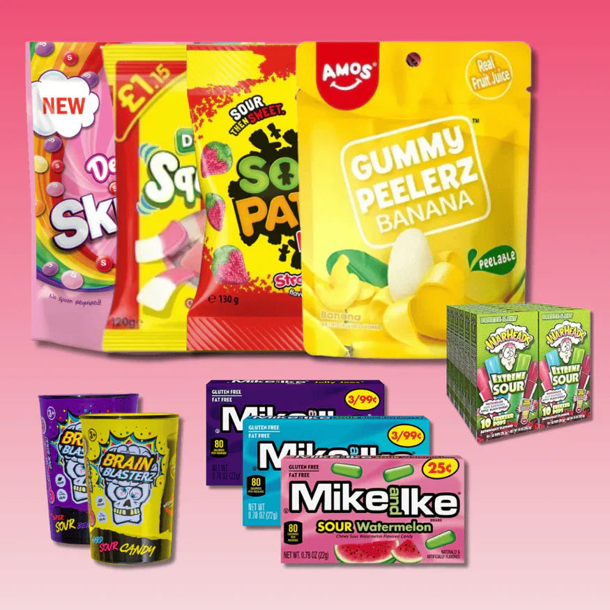 Assortment of American candy packs including Skittles, Sour Patch, and gummy sweets on pink background.